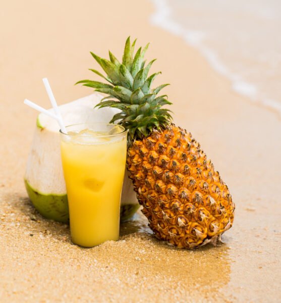 cocktail with fruits on the beach while on vacation