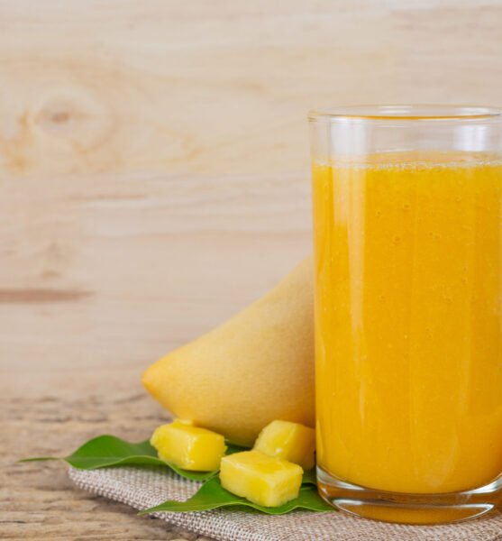 Mango juice on the wooden floor table.